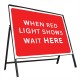 When Red Light Shows Wait Here Sign